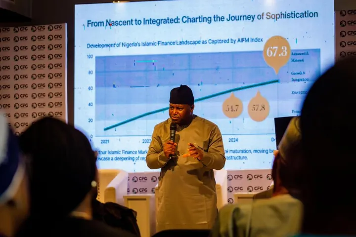 Dr. Oshodi presenting market data at an investor forum